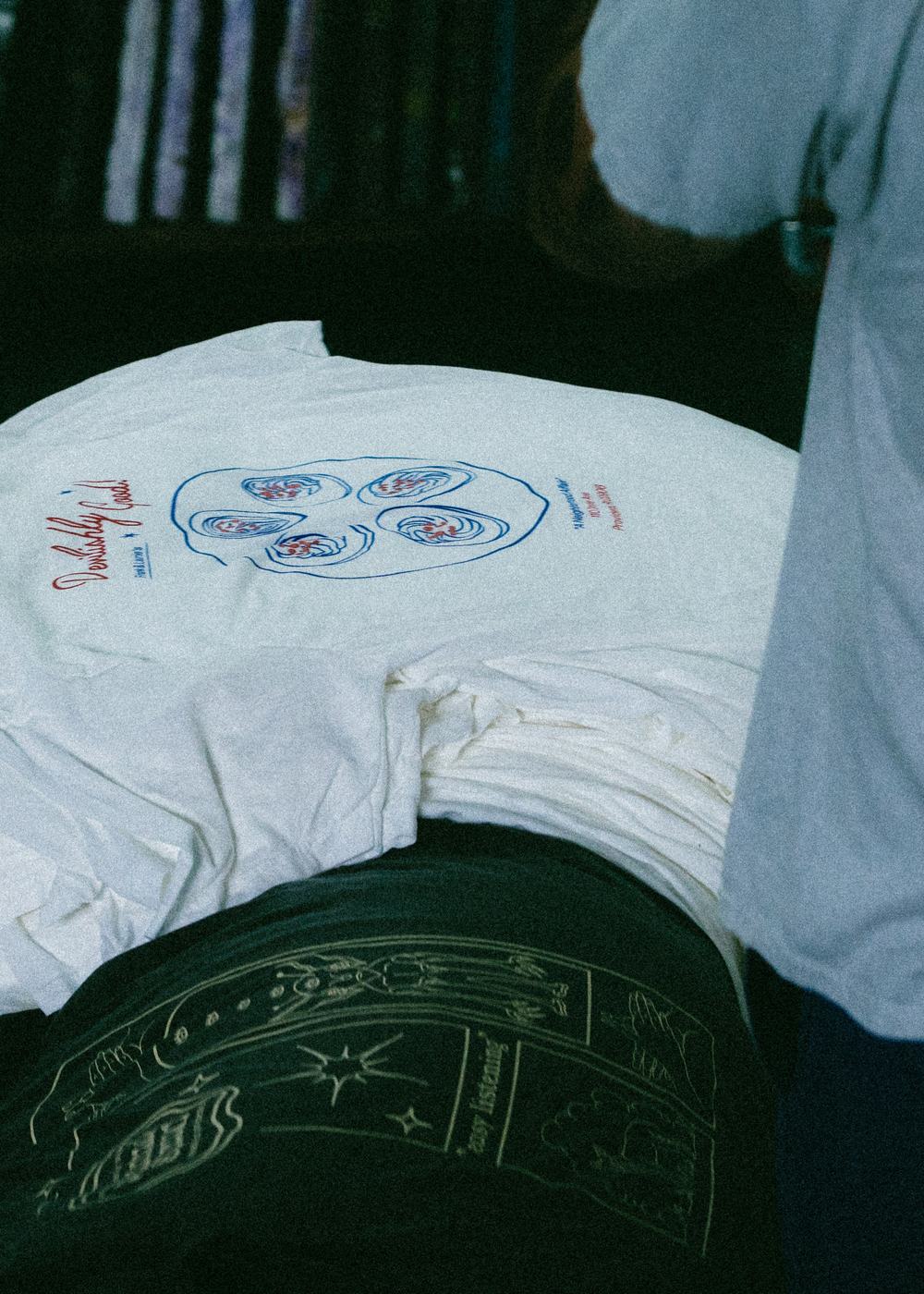 A folded stack of finished Frank & Laurie’s shirts, ready for pickup.